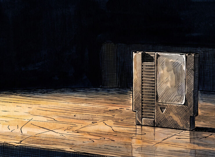 A lone game cartridge standing upright on a dark desk in low side-light